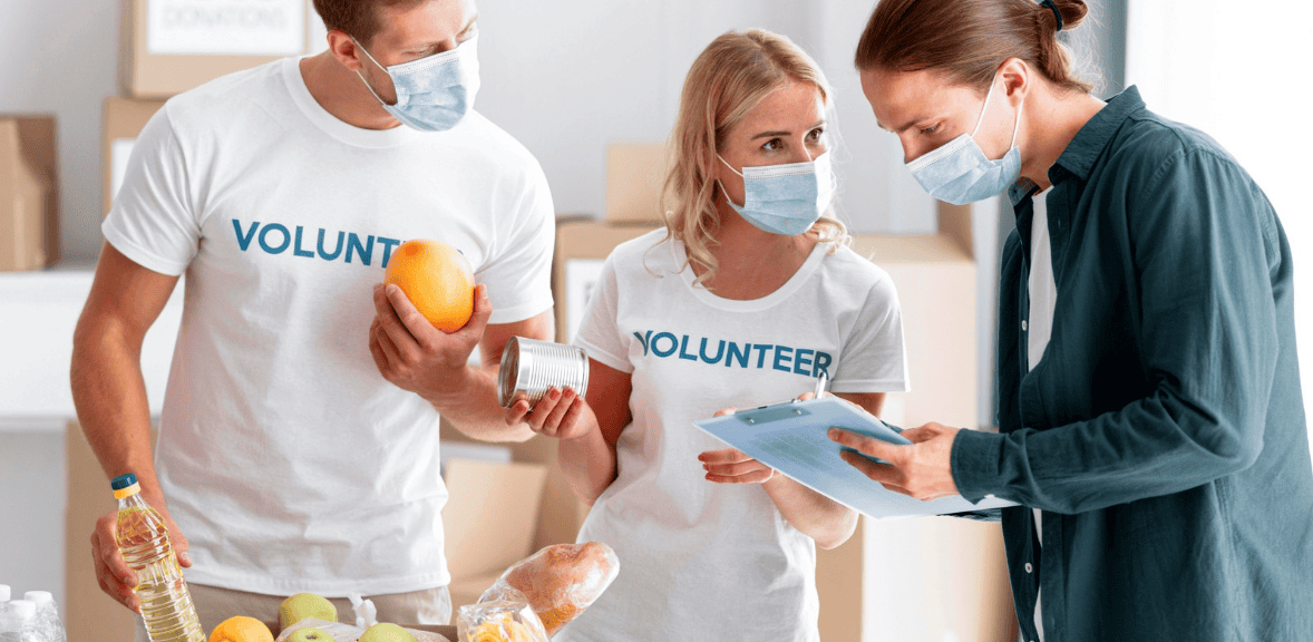 Volunteers and donor discussing